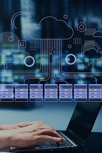 Circuit-board cloud over hands typing on a laptop
