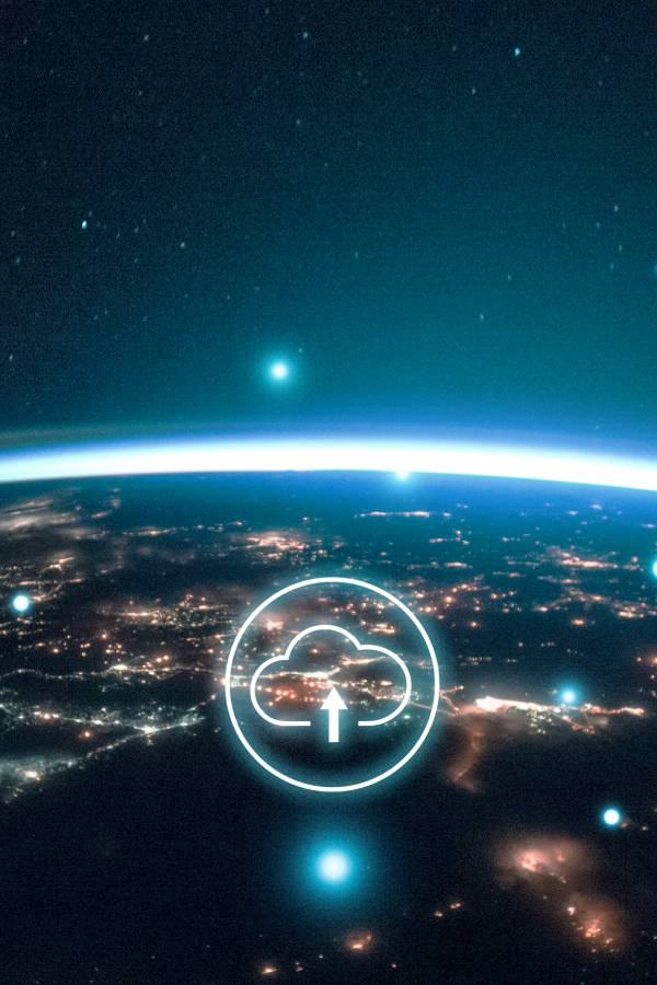 Cloud icon above a city skyline at night