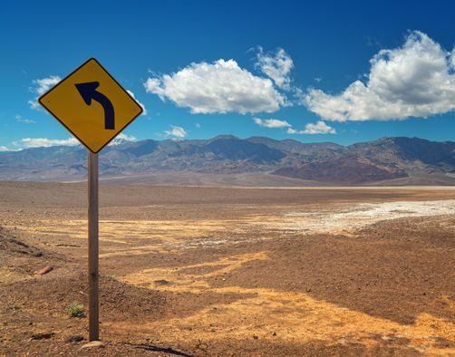 Managed IT services 3 Winding desert road warning sign